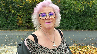 Naughty Granny Tongue Out Flashing Big Tits in Public