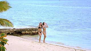 Naughty bikini-clad hotties indulge in a wild threesome by the ocean