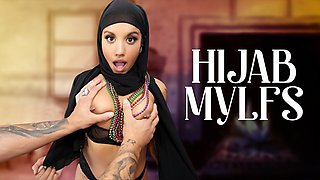 Nina White lifts her hijab for her stepson