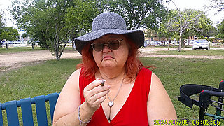Nurse Vicki Smoking in the Park on a Bench All Dressed up