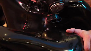German Rubber Slut Get`s Spanked While She Is Bend Over the Knee