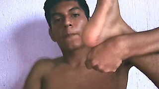 Young Mexican licking his foot