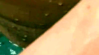 Hot Brunette Fingers Herself Passionately in the Hot Tub