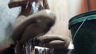 Desi bhabhi Nude bathing for her lover showing hairy black pussy and skinny ass.