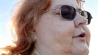 Bearded Lady try's to  lights  on windy beach!
