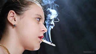Topless Brunette Smoking in Dramatic Smoke