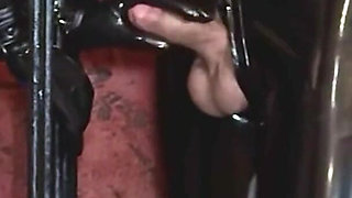 Imprisoned Rubber Slut Has to Give a Blowjob