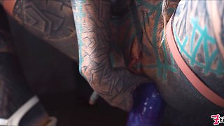 Gorgeous tattooed girl fucks her ass