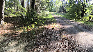 She walks topless through the woods and gets her tits pounded