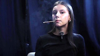 Young Girl Smoking Solo in a Calm Studio Session with Slow Exhales
