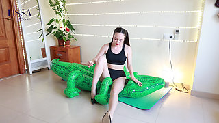 Yoga and Stilettos Destroy the Inflatable Crocodile