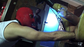Fist fuck in the backroom with leather clothes