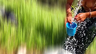 The desi stepsister of the village is bathing openly in the open field, bathing naked in the forest, brother-in-law is secretly