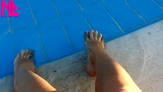 Barefoot Dangling in Swimming Pool Water