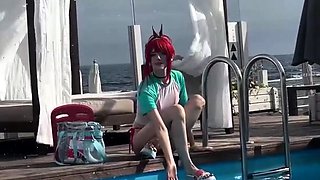 Cosplay redhead teen seductress posing in bikini in the pool
